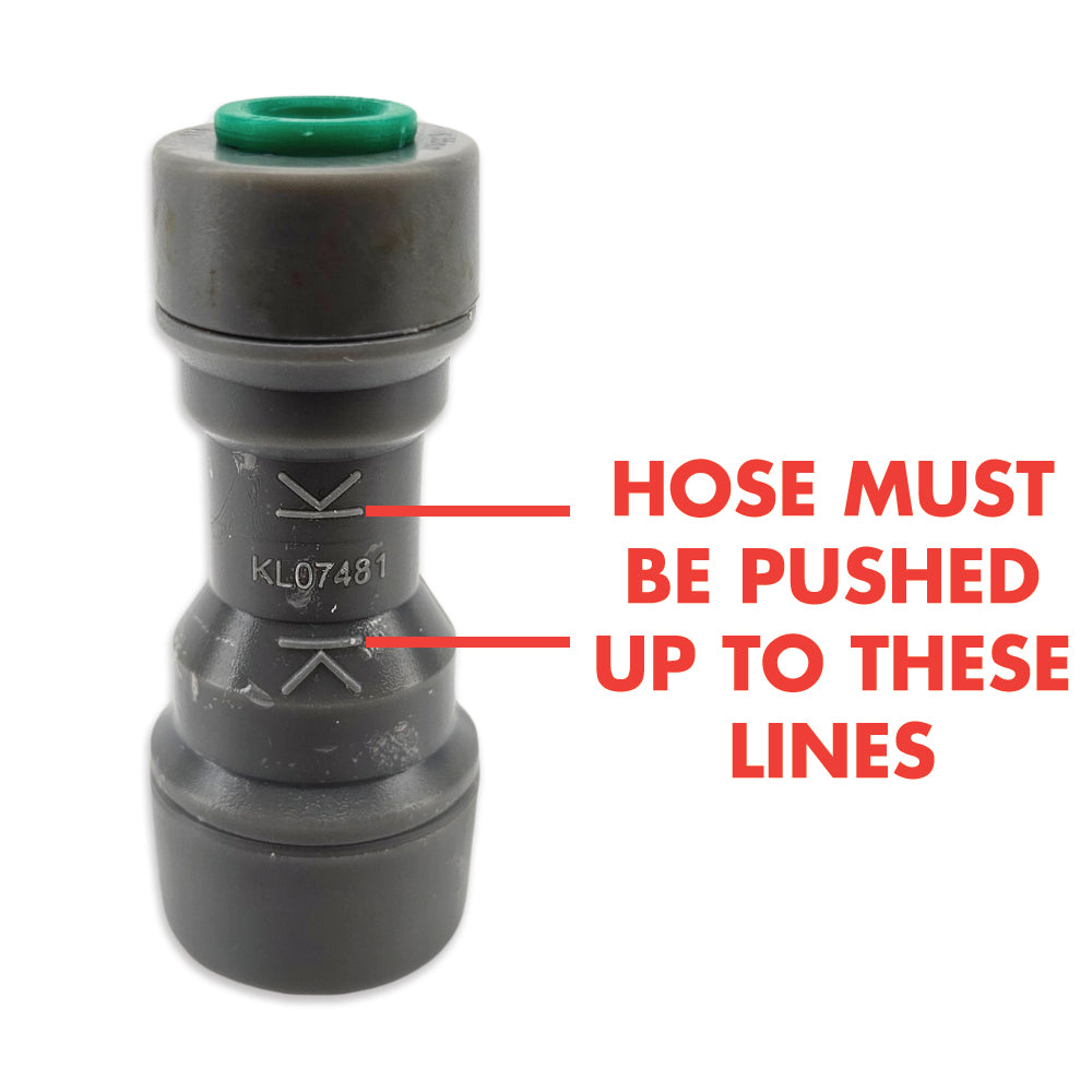 Gray hose connector with green cap and text indicating where to push the hose.